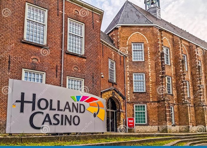 Holland Casino Breda Closeup of the Holland Casino Sign with the Building in the ... photo